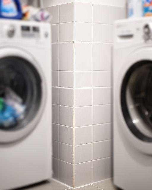 Laundry room tile with refreshed grout and a cleaner, brighter corner after professional washing